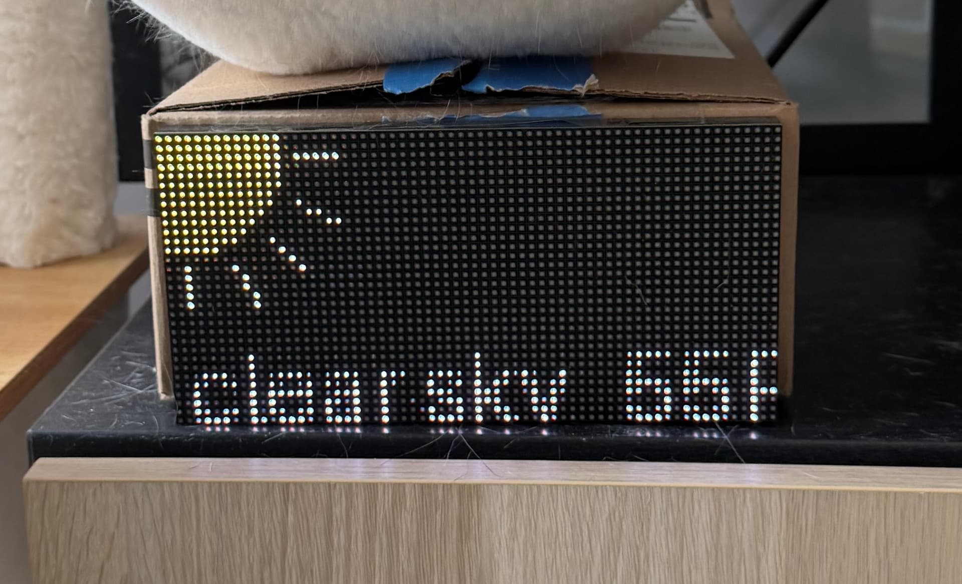 image of an LED panel connected with multicolor wires to a microcontroller